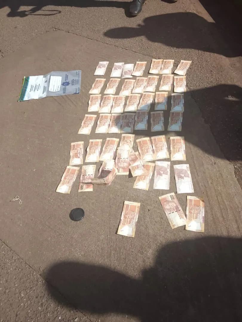 Small sachets recovered at Lomahasha, laid out on the tarmac