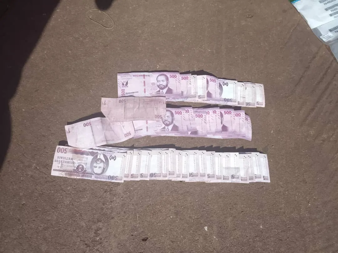 Bundles of banknotes from the cab, photographed on the tarmac